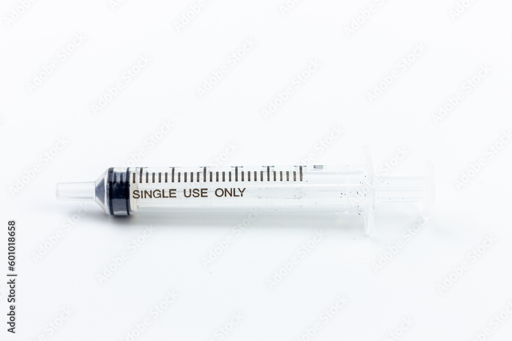 Medical syringe isolated on a white background. Close-up. Medical syringe isolated on a white background. Close-up.