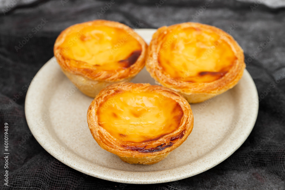 Egg tart, traditional Portuguese dessert, pastel de nata Egg tart, traditional Portuguese dessert, pastel de nata