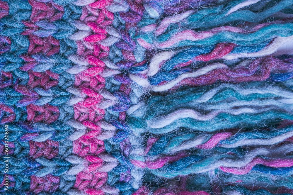 Handmade knit material with macro weave threads.