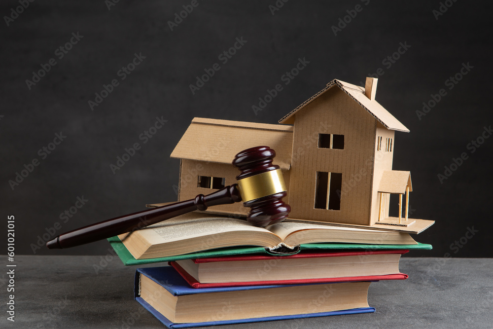 House model, gavel and books on the desk, Real property law concept, real estate auction House model, gavel and books on the desk, Real property law concept, real estate auction