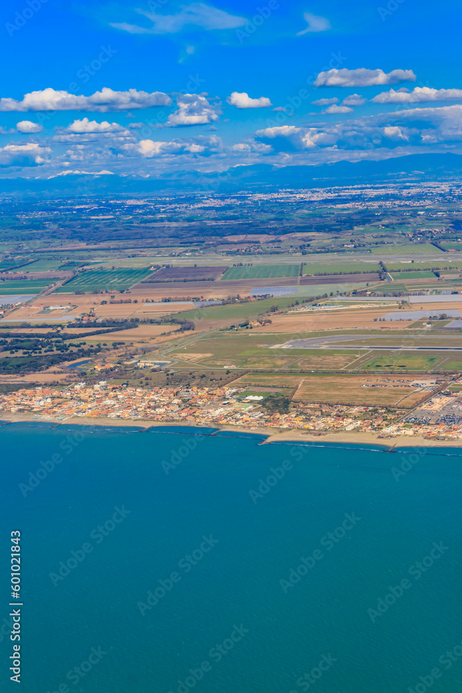 View from a flying plane on Fiumicino bay and the Tyrrhenian sea, Italy