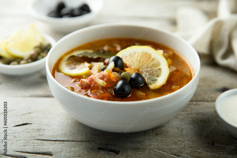 Traditional homemade soup with sausage and capers Traditional homemade soup with sausage and capers