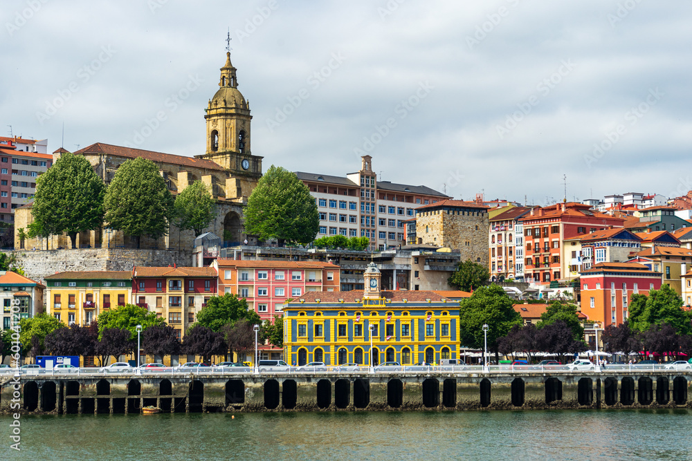 View of Portugalete town by Nervion river, and Sandra Maria basilica, Basque Country, Spain.