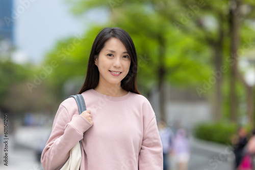 Woman smile to camera in the city