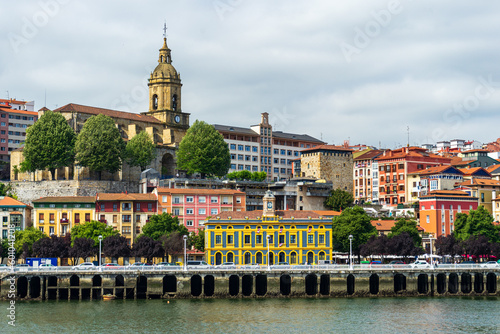 View of Portugalete town by Nervion river, and Sandra Maria basilica, Basque Country, Spain. photo