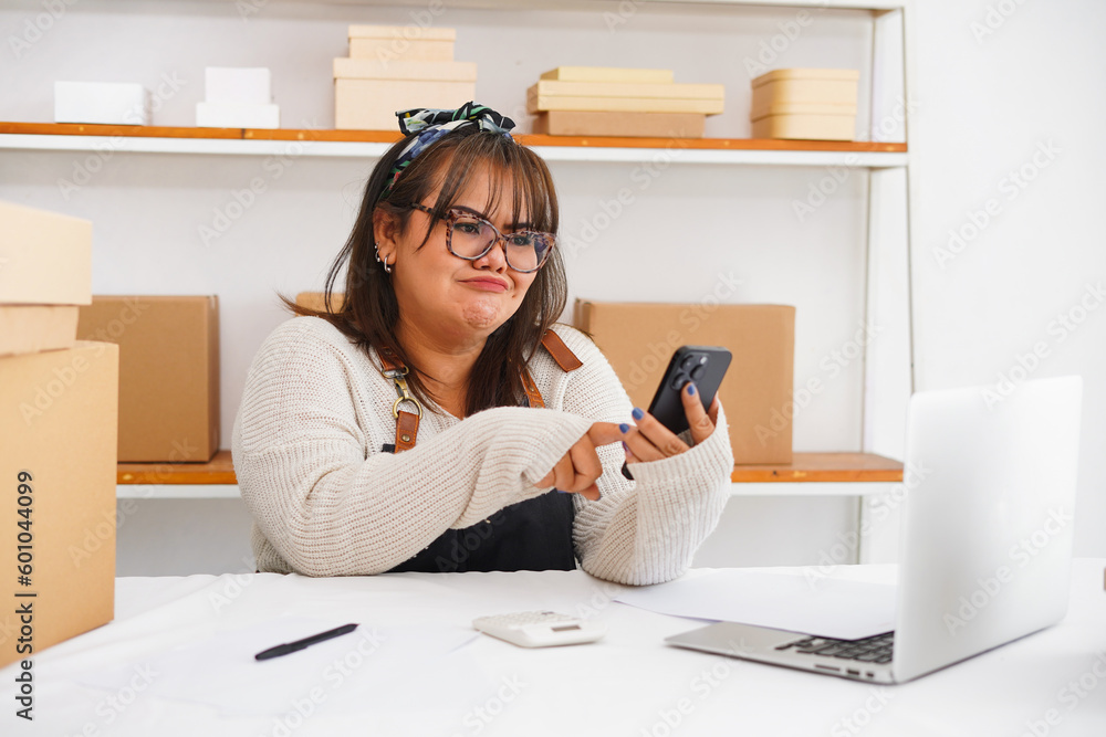 Expression asian woman self employed getting email with bad news about debt bankruptcy service Expression asian woman self employed getting email with bad news about debt bankruptcy service