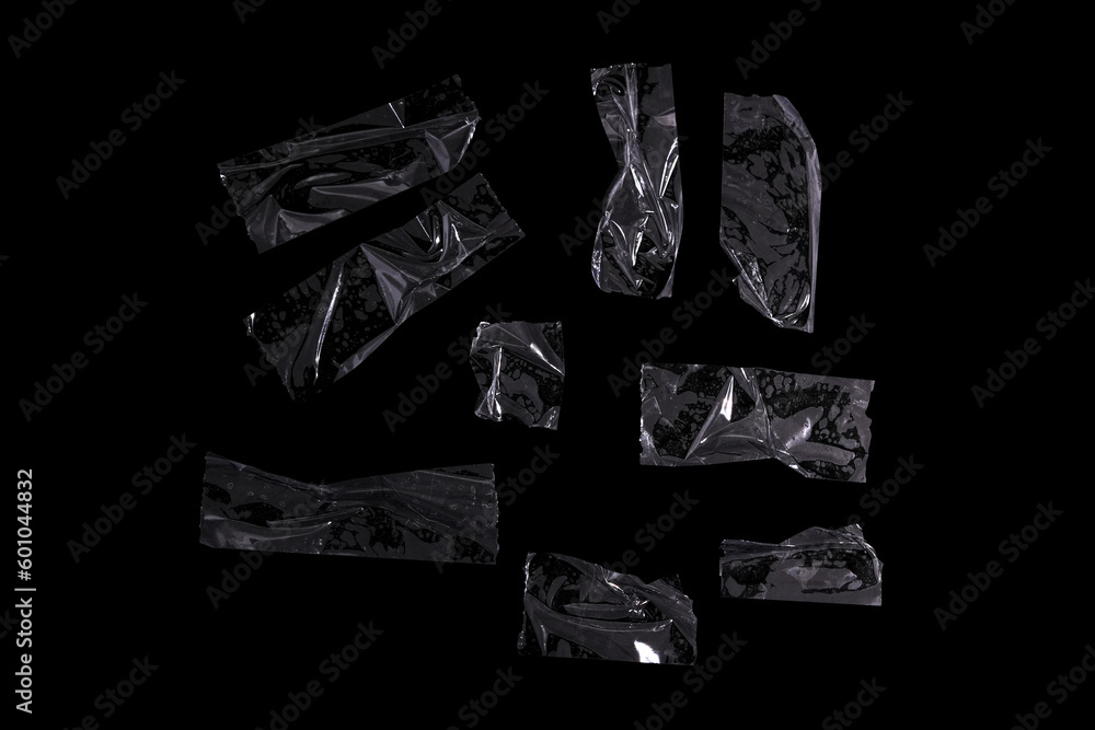 Photo isolated transparent tape pieces on black background