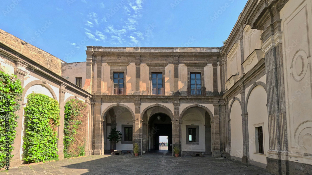 View of the cloister of the ancient Benedictine monastery of San Martino, now transformed into a museum of history and art in Naples, Italy.