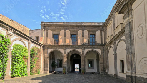 View of the cloister of the ancient Benedictine monastery of San Martino, now transformed into a museum of history and art in Naples, Italy. © Giambattista