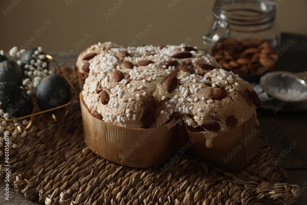 Fototapeta premium Delicious Italian Easter dove cake (traditional Colomba di Pasqua) on wooden table