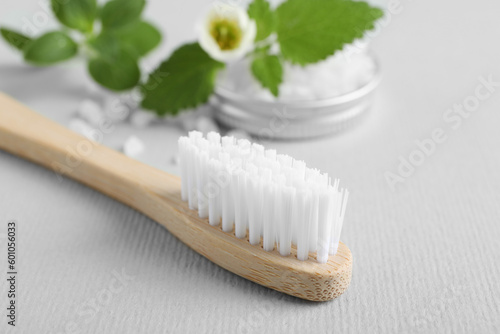 Toothbrush  salt and herbs on white background  closeup