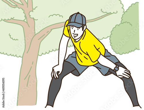 屋外で笑顔でジョギングする若い男性
