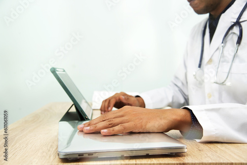 Medicine doctor in medical uniform working with computer notebook at desk in the hospital