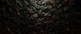 Abstract coal background with lava gaps between the stones.
