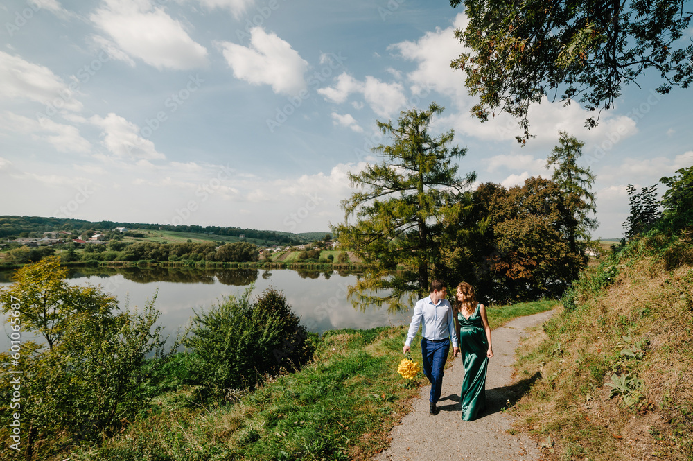 Romantic moments pregnancy. Expecting a child, holding hands each other with love. Happy couple walking outdoors.