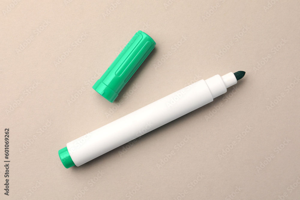 Bright green marker on beige background, flat lay Bright green marker on beige background, flat lay