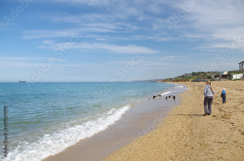 A woman and her son are relaxing on the sea