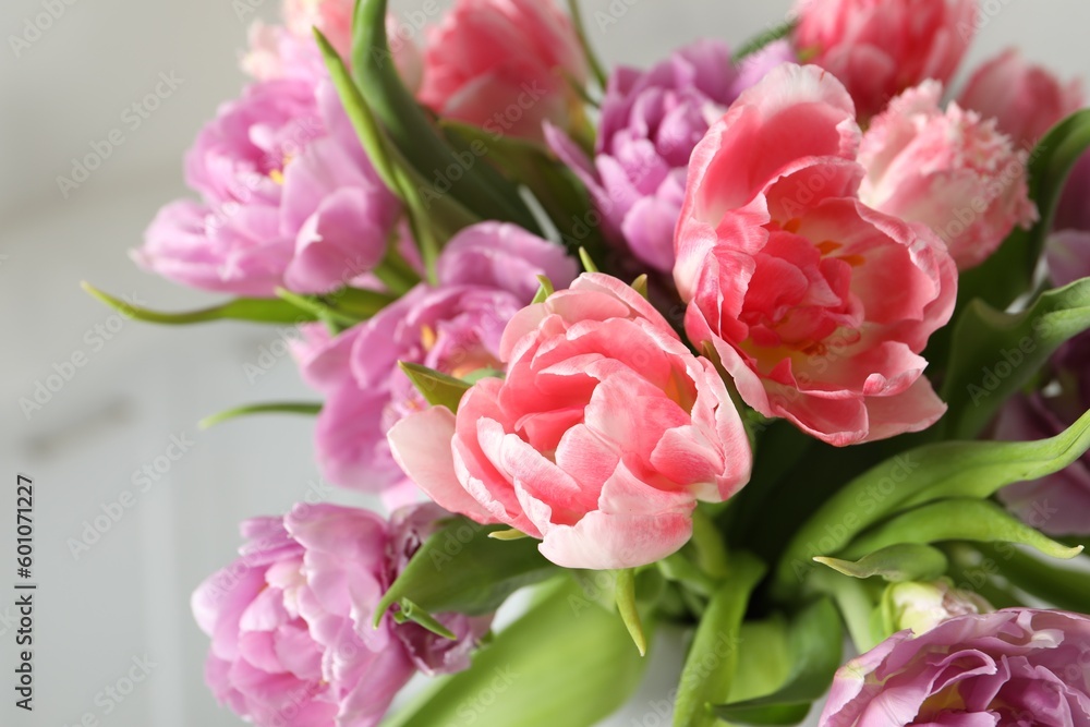 Beautiful bouquet of colorful tulip flowers on blurred background, closeup