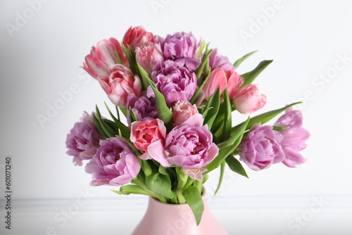 Beautiful bouquet of colorful tulip flowers on white background, closeup © New Africa