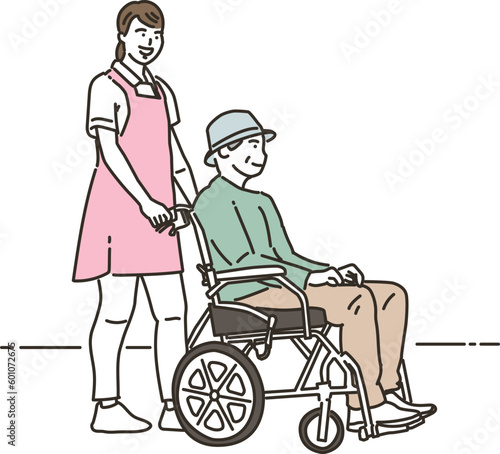 車椅子に乗る高齢者男性と女性の介護士

