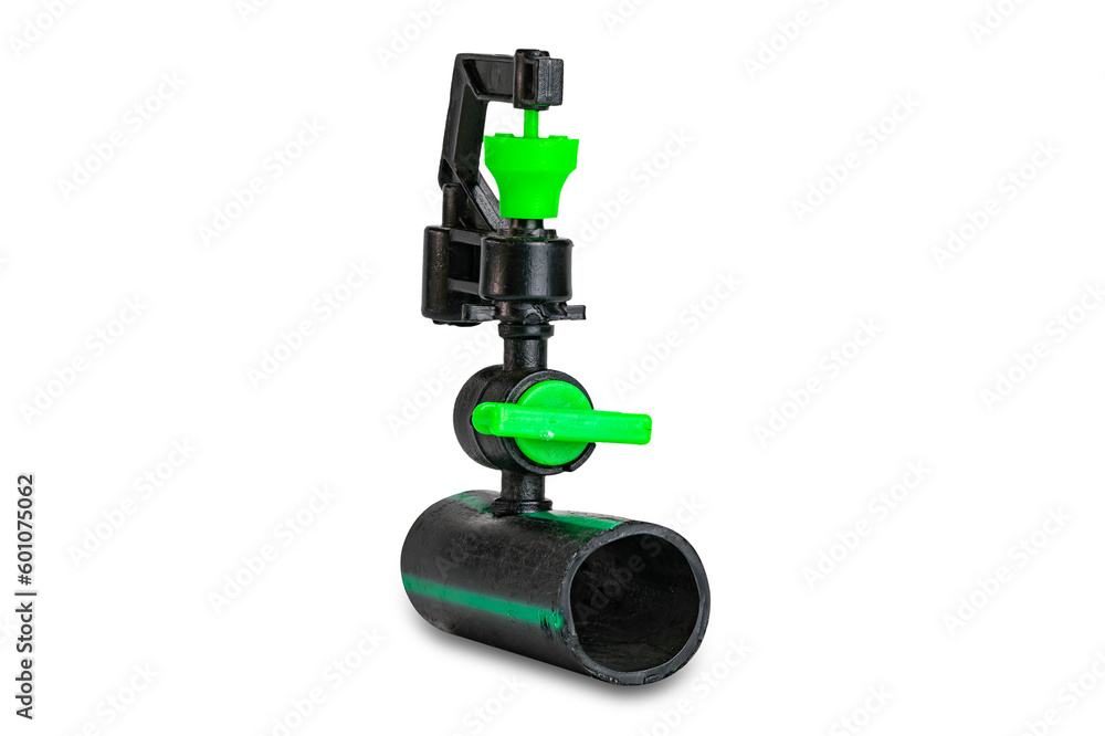 Small black and green color plasticwater sprinkler mounted on old dirty p.e.tube isolated on white background with clipping path. Small black and green color plasticwater sprinkler mounted on old dirty p.e.tube isolated on white background with clipping path.