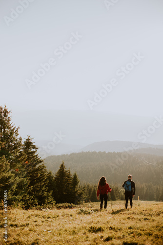 Smiling couple walking with...