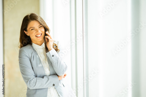 Young woman with mobile pho...