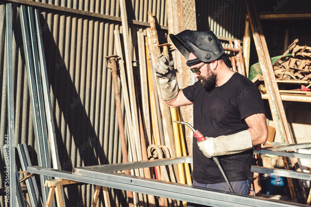 Man welder working in metal unt aller Man welder working in metal unt aller