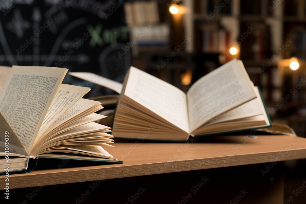 open books on the table in the library open books on the table in the library