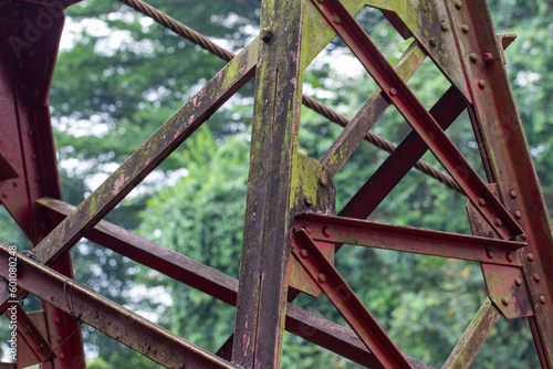 the old iron construction is rusty and overgrown with moss