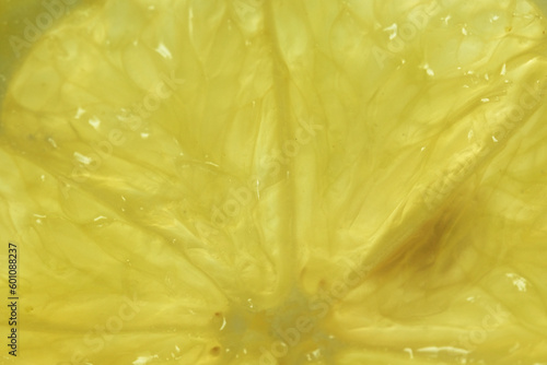 Macro closeup of bright yellow lemon pulp texture.