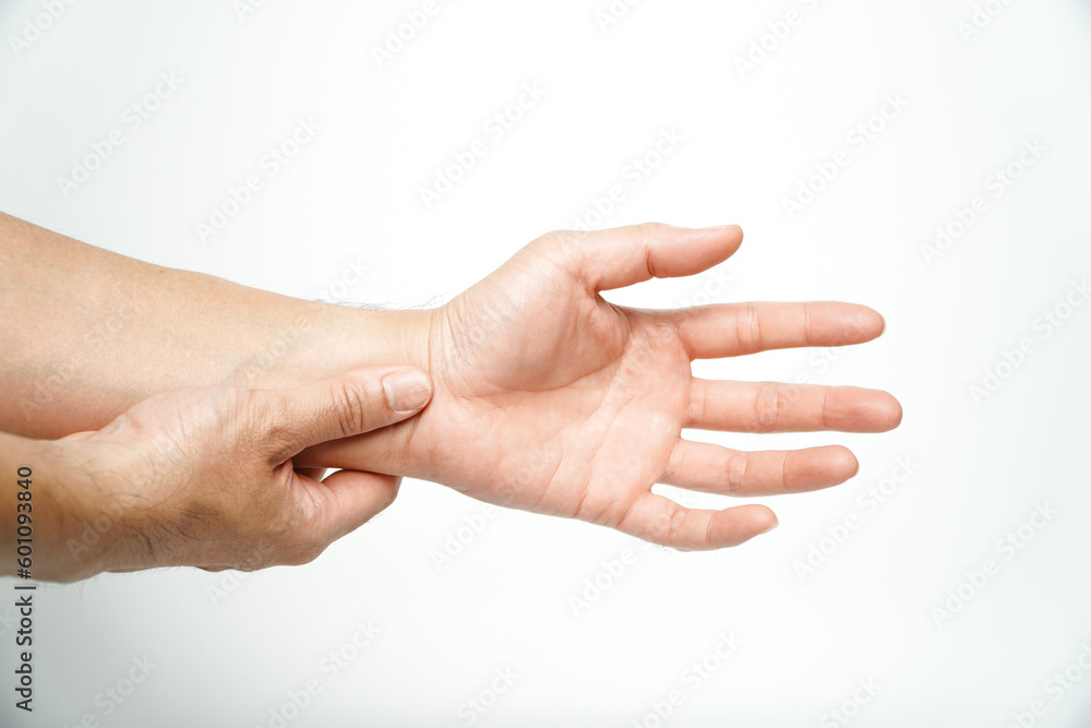 Concept wrist symptomatic Office Syndrome,Asian man hand holding his pain wrist isolated on background,Chronic wrist inflammation. Suffering arthritis hand.