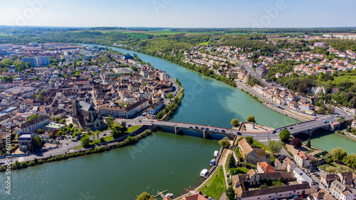 Aerial view of the confluence between the Seine and the Yonne showing different colors of water mixing in the town of Montereau Fault Yonne in Seine et Marne, France photo