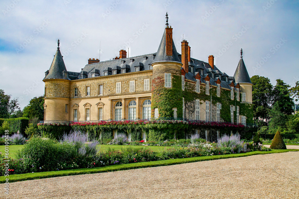 Fototapeta premium Castle of Rambouillet near Paris, Yvelines, France - Old stately home that was the official residence of the Presidents of the French Republic with round turrets covered with vines
