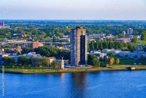 Aerial view of a tall appartment building built close to the New Meuse river in Rotterdam, the Netherlands