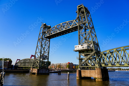 Koningshavenbrug   King s Haven Bridge   is an industrial-style railway bridge across the Nieuwe Maas in Rotterdam  the Netherlands. The central part of this bridge is raised thanks to a pulley system
