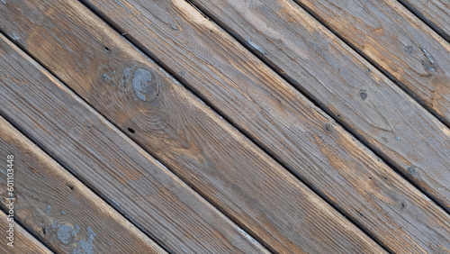 Texture of a wooden surface from old boards arranged diagonally