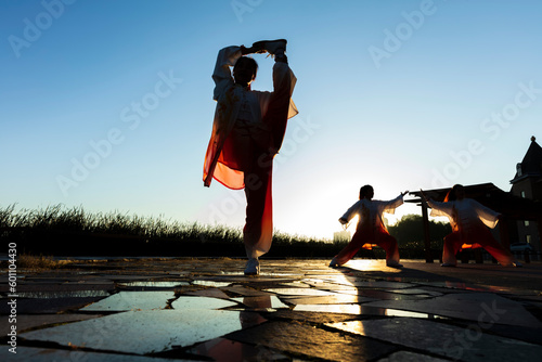 A woman practices Tai chi, the Chinese martial art photo