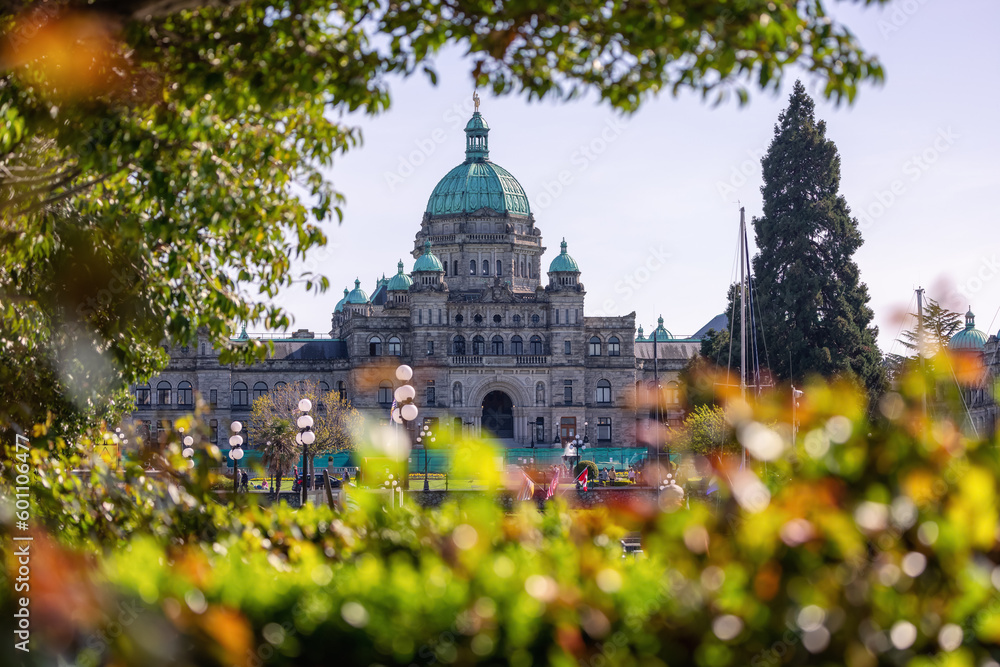 Legislative Assembly of British Columbia in the Capital City during a sunny day. Downtown Victoria, Vancouver Island, BC, Canada. Flowers