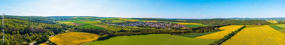 Panoramic aerial view of the Taunus landscape with flowering rapeseed fields near Hünstetten - Germany