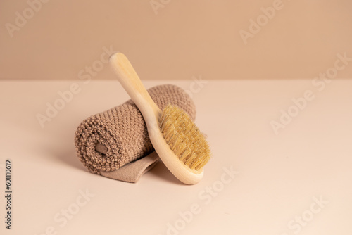 Massage brush and a towel. Eco-friendly items. Biodegradable personal care products.