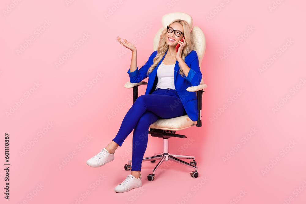 Fototapeta premium Photo of business lady recruiter sit office armchair hold smartphone talk partner colleague isolated pink color background