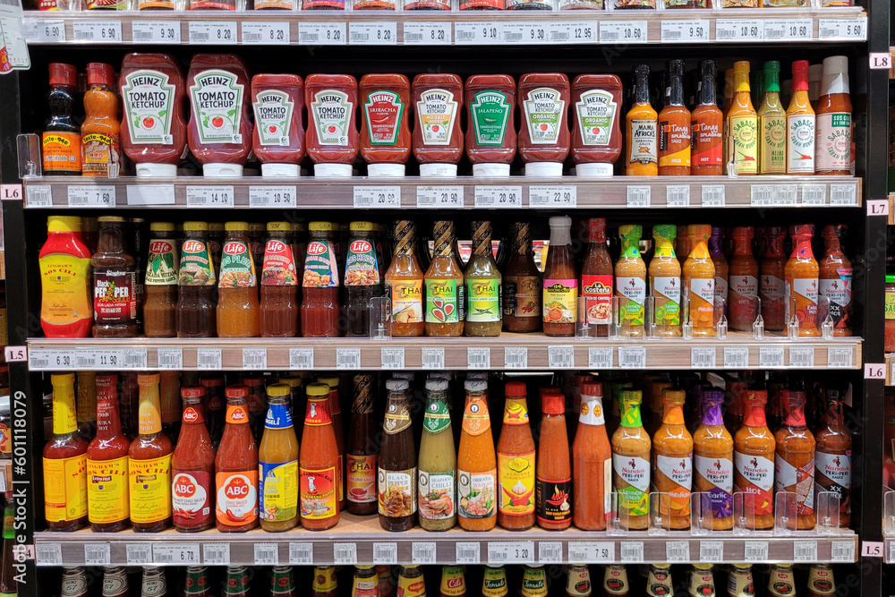 PENANG, MALAYSIA 3 MAY 2023 A wide array of salad dressings, chili