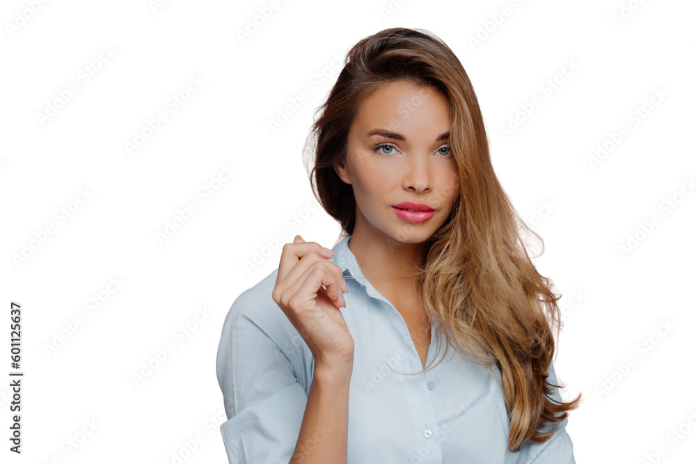 Confident European woman with natural beauty models against white background, dressed in a shirt, well-cared face and makeup, keeping her arm raised Confident European woman with natural beauty models against white background, dressed in a shirt, well-cared face and makeup, keeping her arm raised