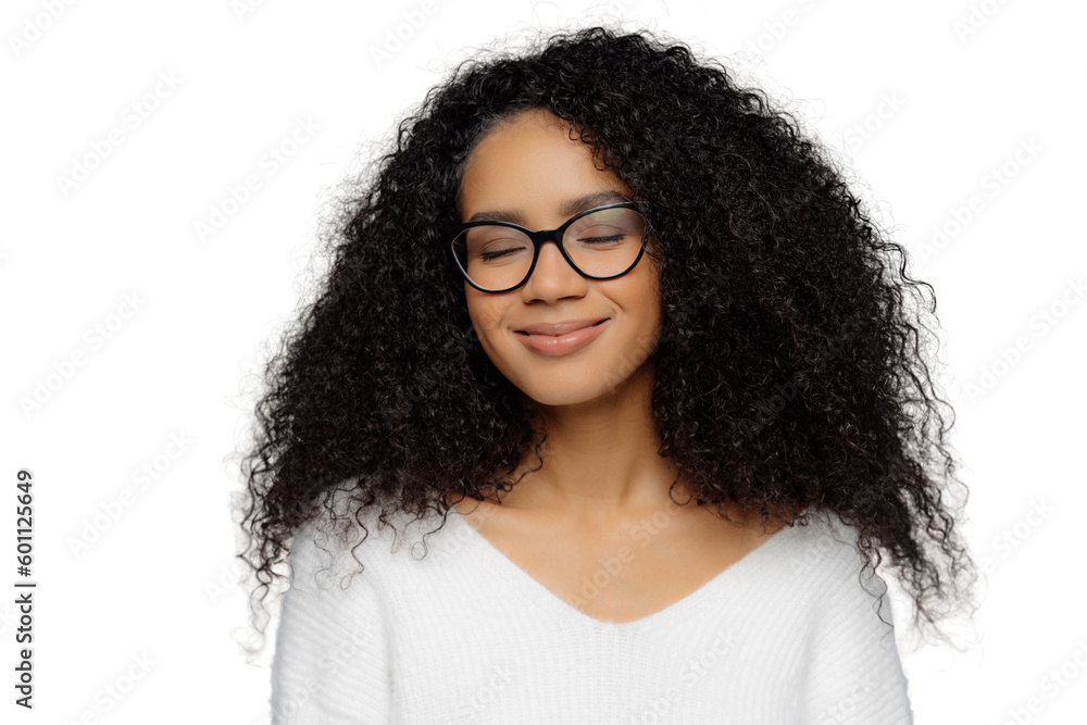 Smiling woman with bushy hair and glasses imagines, isolated on white Smiling woman with bushy hair and glasses imagines, isolated on white