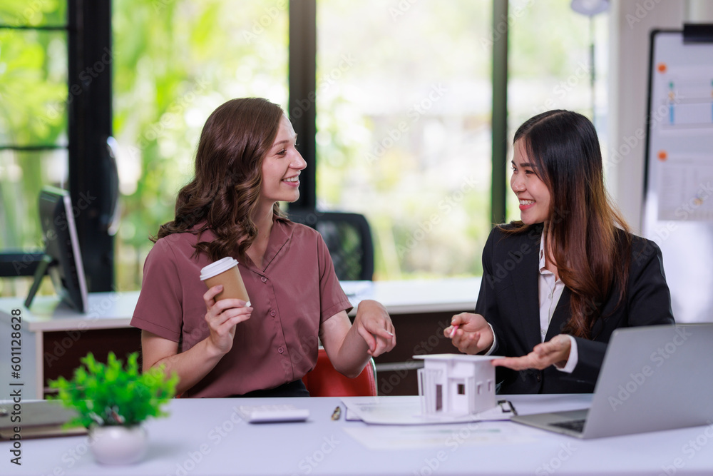 Home sales,home rental and real estate concept.Real estate agent explain about the terms of the home purchase or rental agreement to customer before sign contract Home sales,home rental and real estate concept.Real estate agent explain about the terms of the home purchase or rental agreement to customer before sign contract