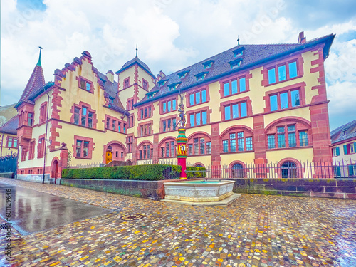 Small square with Sevogel Brunnen fountain and scenic building of State Archives Basel-Stadt in Basel, Switzerland