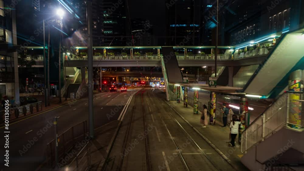 Motion Time lapse View from the front of tram in Hong Kong Moving along the roads in the center of Hong Kong Island. Trams run in Hong Kong's financial district at night and pick up passengers. Motion Time lapse View from the front of tram in Hong Kong Moving along the roads in the center of Hong Kong Island. Trams run in Hong Kong's financial district at night and pick up passengers.