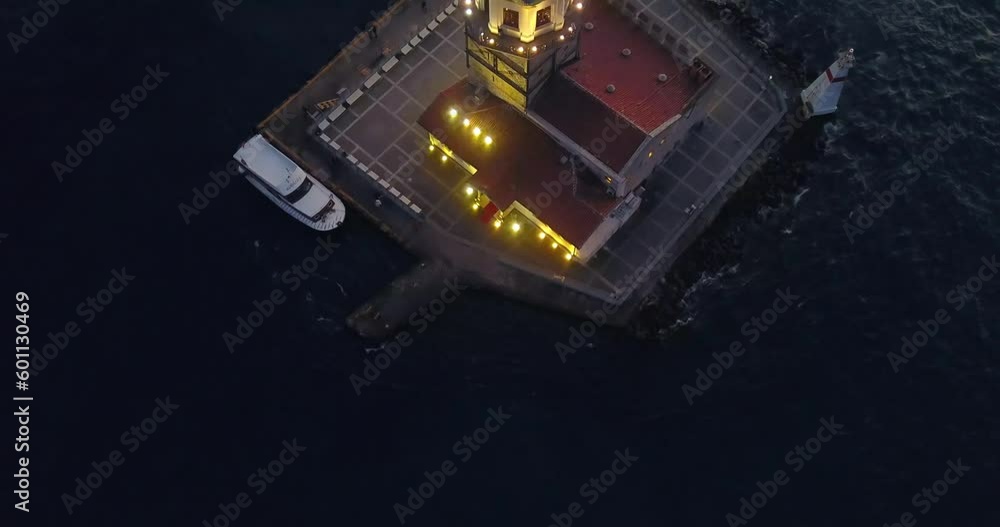 Top down view of Maidens Tower, historical lighthouse of the Istanbul City. Flying over the Leanders Tower, Kizkulesi at night
