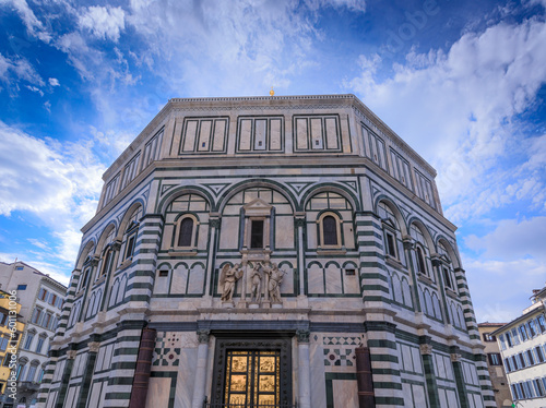 The Florence Baptistery in Italy. The Baptistery  of Saint John is one of the oldest buildings in Florence constructed in the Florentine Romanesque style. photo